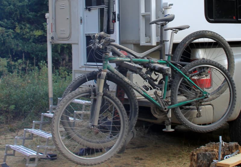 Swing-out bike rack for easy access to camper