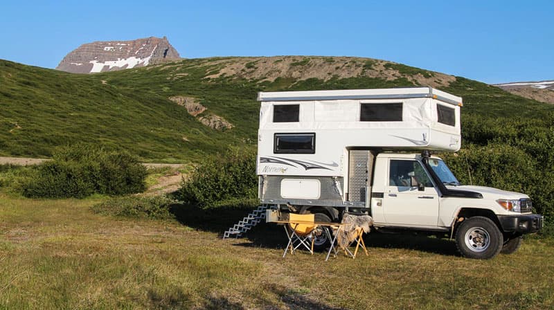 truck-camper-flatbed-toyota-preparing-dinner