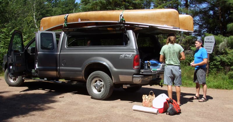 Using a truck tropper to haul canoes