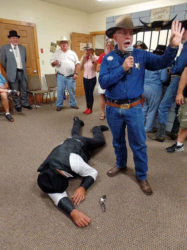 Mitch Maverick killed and Marshal Dalton taking care of it, photo taken by Gus Postreich